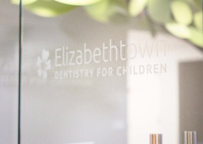 dentistry for children logo on glass door